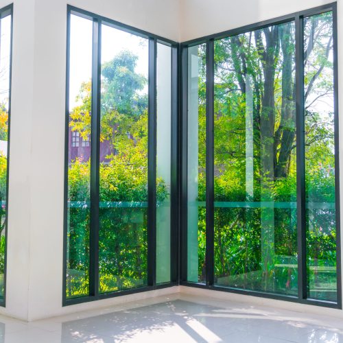 Glass window overlooking green garden